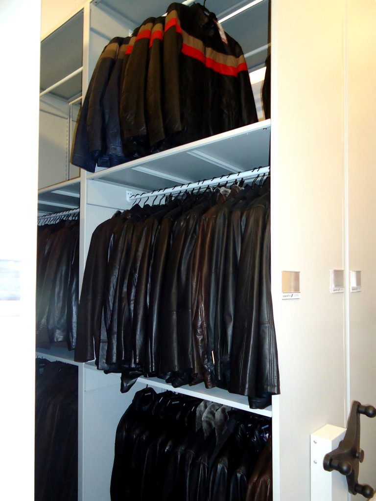 image of high density storage in retail setting:  hanging rods